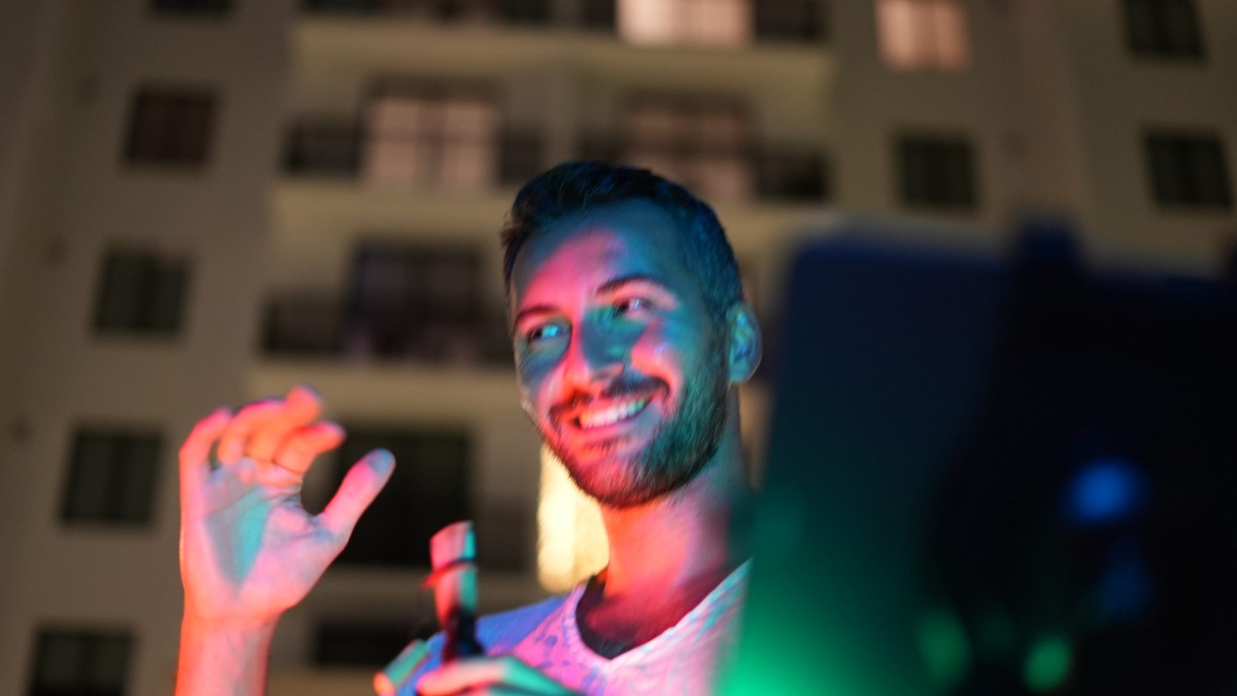 Alp Akmaz smiling on stage
